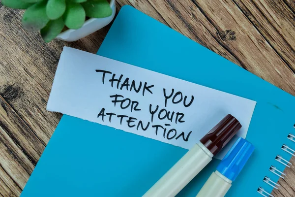 Concept of Thank You For Your Attention write on sticky notes isolated on Wooden Table.