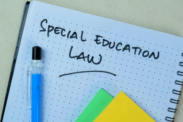 Concept of Special Education Law write on book isolated on Wooden Table.