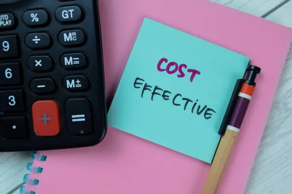 Concept of Cost Effective write on sticky notes isolated on Wooden Table.