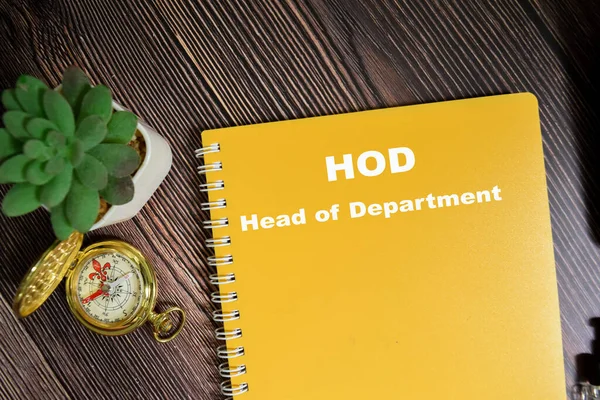 Concept of HOD - Head of Department write on book isolated on Wooden Table.