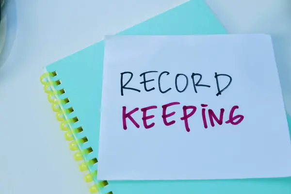 Concept of Record Keeping write on sticky notes isolated on white background.