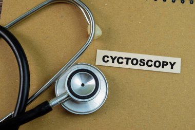 Concept of Cyctoscopy write on sticky notes with stethoscope isolated on Wooden Table. clipart