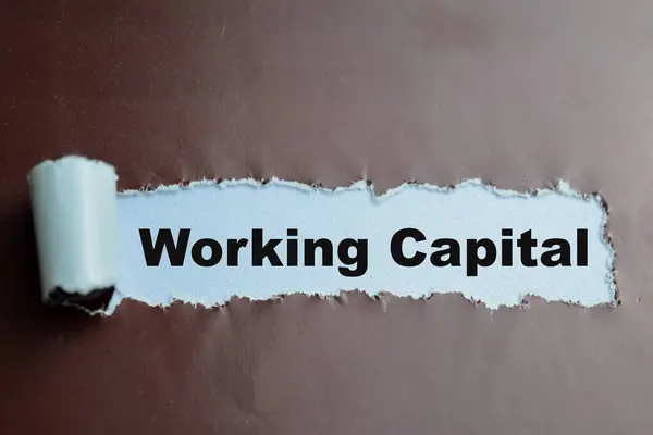 Concept of Working Capital Text written in torn paper.