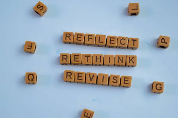 stock image Concept of Reflect, Rethink, Revise written on wooden blocks. Cross processed image on Wooden Background
