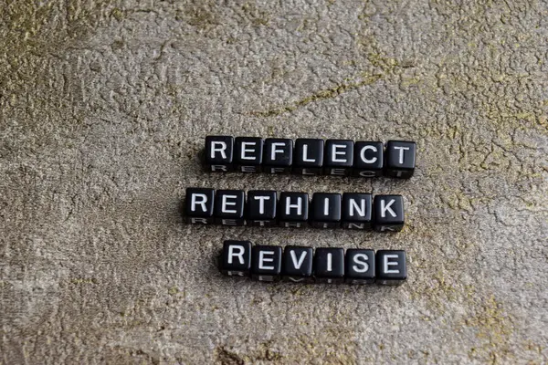 stock image Concept of Reflect, Rethink, revise written on wooden blocks. Cross processed image on Wooden Background