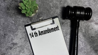 Concept of 14 th Amandement write on paperwork isolated on wooden background. clipart