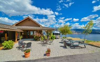 Vacant outdoor cafe on high shore of Okanagan lake.
