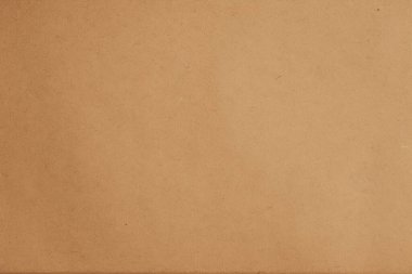 Kahverengi kağıt arka plan. Bej renkli karton desen. Duvar kağıdı. Koyu bej ambalaj kağıdı arka planı.