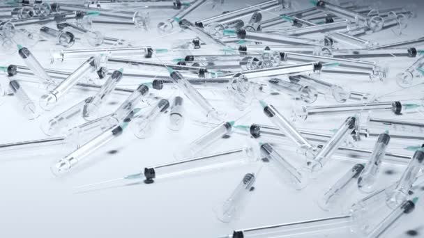 使用済みの一般的なプラスチック使い捨てシリンジの山 医療廃棄物について 透明なプラスチックシリンジのシームレスなループアニメーション 薬物依存 糖尿病 ワクチン接種の概念 4Kについて — ストック動画