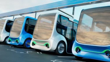 Elektrikli arabalar şarj istasyonu. Minibüsler bataryaları şarj etmek için otoparkta durdu. Çevre dostu araba kavramı. Elektrikli arabalar elektriğe takılıyor. Elektrohareketlilik.