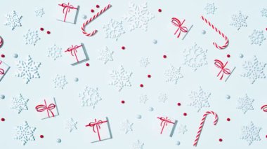 Güzel Noel tatlıları ve dekorasyon arkaplanının kusursuz döngüsü. Beyaz kurdeleli, parlak şekerli, bastonlu ve kar taneli beyaz hediyeler. Neşeli kış kutlaması.