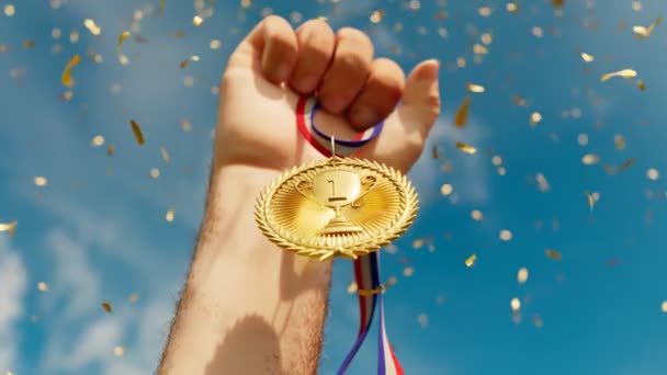 Rising Hand Holding Shiny Gold Medal Top Winner First Prize — Stock Video