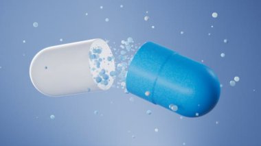 Büyük mavi bir kapsül küçük ilaç parçacıklarını ya da mavi arka planda antibiyotiği kapsar. Eczane, sağlık ve ilaç kavramı, terapi. Bir kapsülün içinde yüzen kabarcıklar kapalı.