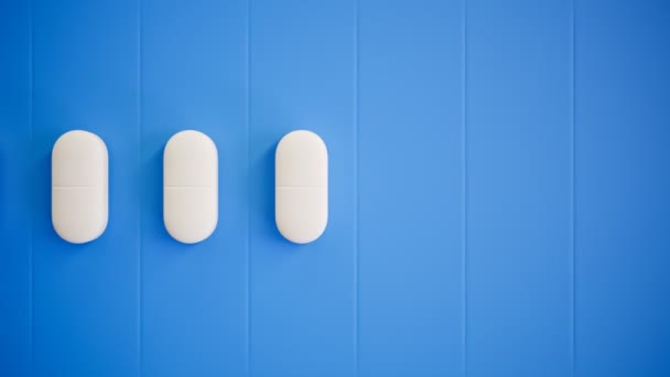 Pastillas Blancas Seguidas Fondo Azul Antecedentes Perfectos Para Medicina Farmacia — Vídeos de Stock