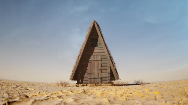 砂漠の真ん中で放棄された古いログキャビン 空っぽで乾燥した ひび割れた地表 木材とストローで作られた小さな無人の家を持つ砂漠の風景 シェルター ワンダラーズ ハット — ストック動画