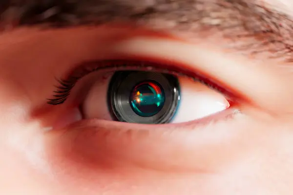 Close up of an eye camera implant slowly focusing the view. Futuristic optical lens instrument in place of the iris. A sophisticated piece of cyborg technology mixing human and machine.