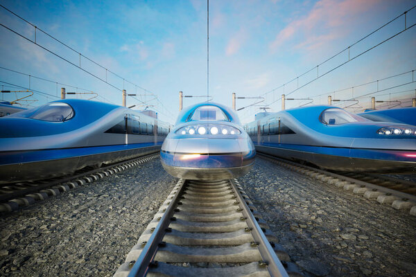Ряд гладких, современных скоростных поездов на станции, установленных против ясного голубого неба. Идеально подходит для транспортировки или связанных с технологиями концепций.