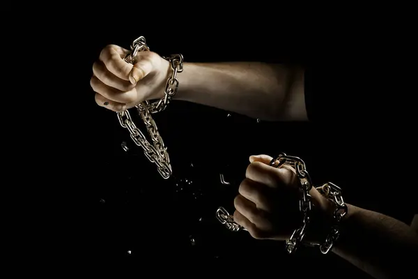 3d rendering od Hands breaking silver chains. Metal or steel chain is blown to pieces. Concept of regains freedom. Break free from weakness. Symbol of strength, free, liberty. Powerful independence.