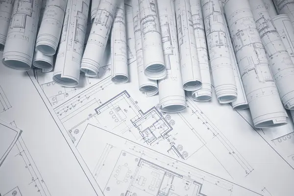 Building blueprints. From floor plans to construction plans. An image captures the essence of building projects and the creativity involved in architectural design. Architectural design and precision.