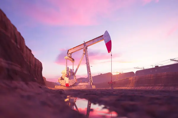 泥で満たされた洪水の発掘のポンプジャック 日没する空の背景で油田で石油化学装置を働かせています 原油抽出プロセスをサポート — ストック写真