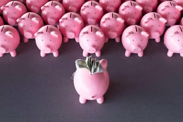 A piggy bank confidently standing in front of other piggy banks, with a substantial stack of money. Concept of power, wealth, and financial success. The visual metaphor for financial themes and ideas