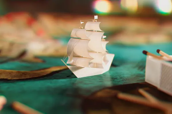 Exquisitely Detailed Miniature Sailboat Model Showcased Multicolored Blurred Background Symbolizing — Stock Photo, Image