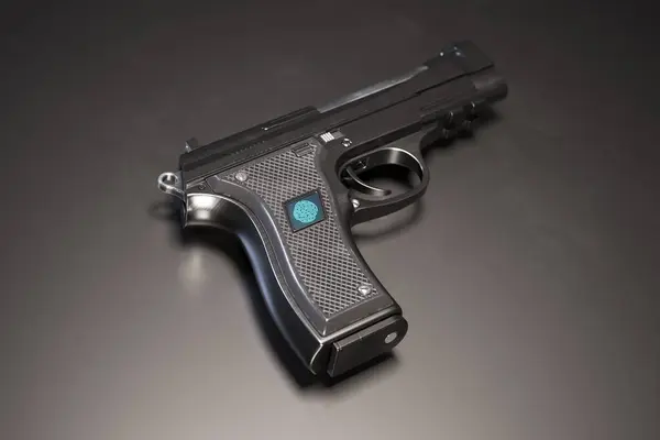 An innovative, high-security handgun featuring a state-of-the-art biometric fingerprint scanner integrated into the grip for enhanced authorized user identification and use.