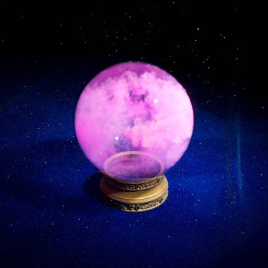 An enigmatic crystal ball showcasing a mesmerizing cosmic galaxy rests upon an elaborate stand, surrounded by the allure of a starry night, inviting mystical explorations. clipart