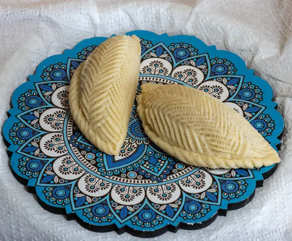 stock image Shekarbura. belonging to Azerbaijan It is a sweet pastry in half-moon shape, filled with ground almonds, hazelnuts, or walnuts, and sugar.