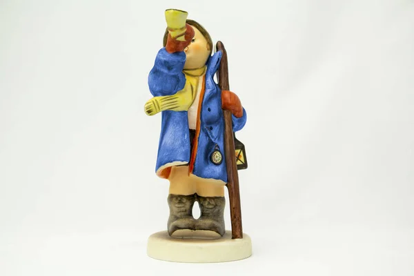 Porcelain figurine of a shepherd boy with a musical trumpet. Geobel. High quality photo