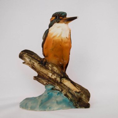 Detailed Kingfisher Bird Figurine on Wood Log Isolated on White. High quality photo clipart