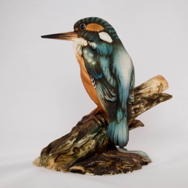 Detailed Kingfisher Bird Figurine on Wood Log Isolated on White. High quality photo clipart