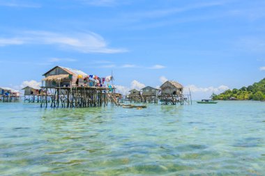 Beautiful landscapes view borneo sea gypsy water village in Bodgaya Mabul Island, Semporna Sabah, Malaysia. clipart