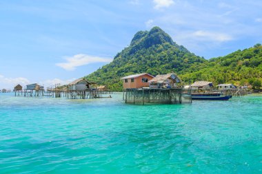 Beautiful landscapes view borneo sea gypsy water village in Bodgaya Mabul Island, Semporna Sabah, Malaysia. clipart