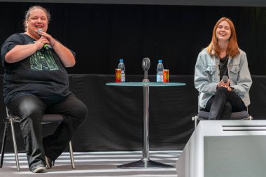 STUTTGART, GERMANY - JUN 29th 2019: Karen Gillan (*1987, Scottish actress and former model) talks about her experiences in the movie industry at Comic Con Germany Stuttgart, a two day fan convention clipart