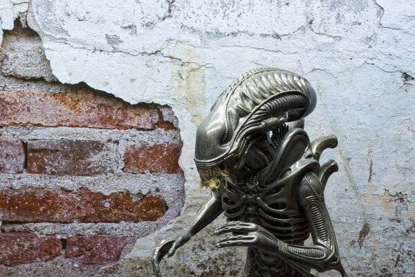 Bologna - Italy - November 4, 2022: Alien Xenomorph. Action figure from the original Alien movie by Twentieth Century Fox.