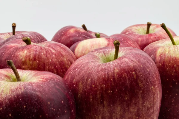 Fresh red apples on white background. Closeup