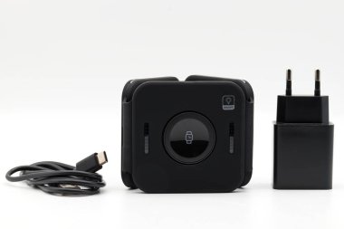 Foldable Wireless Charger isolated on white background. Wireless charging pad, mobile phones, smart watches, earphones. Charging device all in one concept.