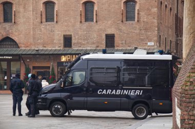 Bologna - Italy - December 31, 2022: Van of Italian Police Force Carabinieri in Piazza Maggiore, Bologna.