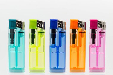 Set of transparent lighters in a row isolated on white background.