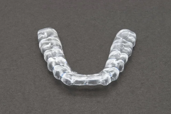 stock image Bite plate to protect teeth at night from grinding. Mobile orthodontic appliance.