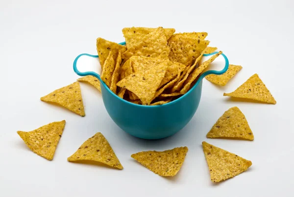 Nachos in a plastic bowl. Tortilla chips isolated on white background.