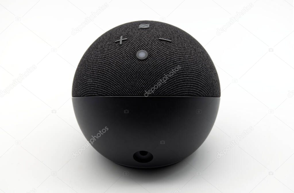 Bologna - Italy - July 23, 2024: Amazon Echo Dot. Alexa, virtual assistant AI isolated on white background.