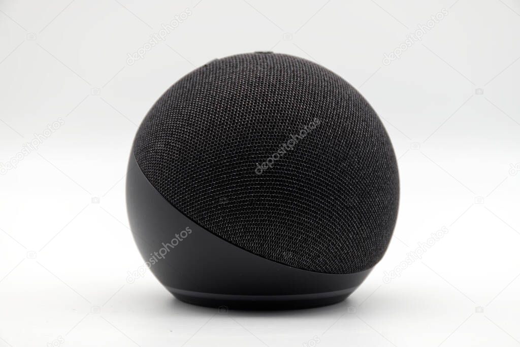 Bologna - Italy - July 23, 2024: Amazon Echo Dot. Alexa, virtual assistant AI on white.