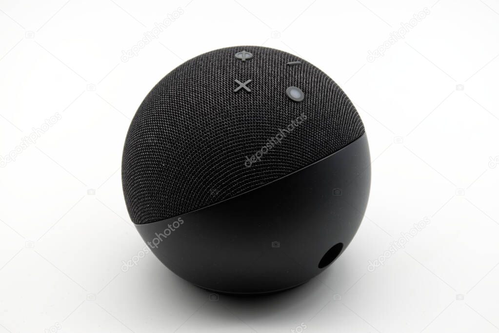 Bologna - Italy - July 23, 2024: Amazon Echo Dot. Alexa, virtual assistant AI on white background.