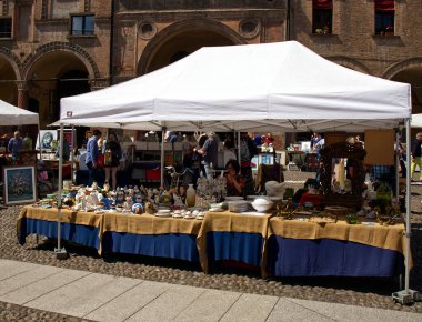 Bologna - Italy - May 11, 2024: Antique street market in Santo Stefano square, near Santo Stefano Church. clipart