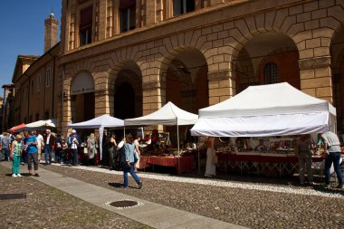 Bologna - Italy - May 11, 2024: Antique street market in Santo Stefano square, near Santo Stefano Church. clipart