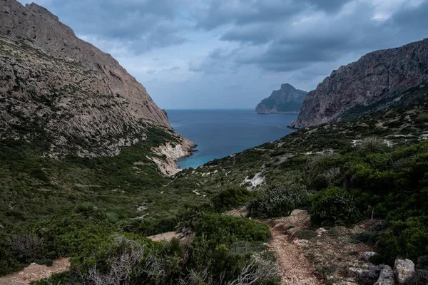 stock image Hiking in the landscape of Mallorca to discover breathtaking scenery like this small cove