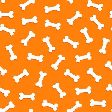 Turuncu bir zemine saçılmış, kusursuz beyaz kemik koleksiyonu.