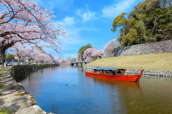 stock image Shiga, Japan - April 3 2023: Hikone Castle Yakatabune Cruise is a sightseeing tour around the castle moat in a reconstructed boat